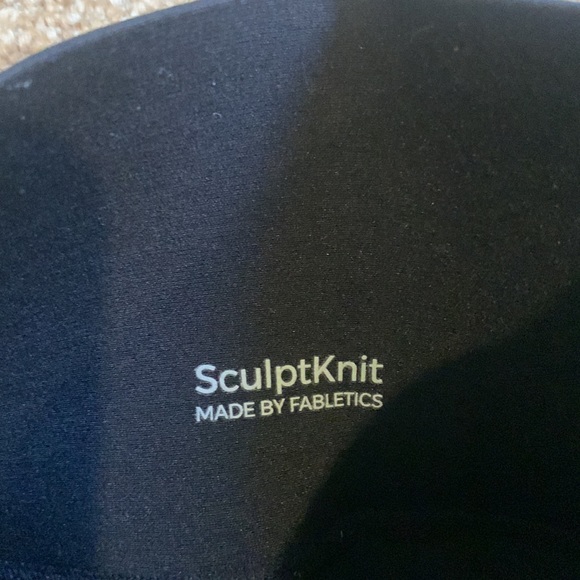 These are small form fitting black leggings by SculpKnit made by Fabletics. - Picture 3 of 3